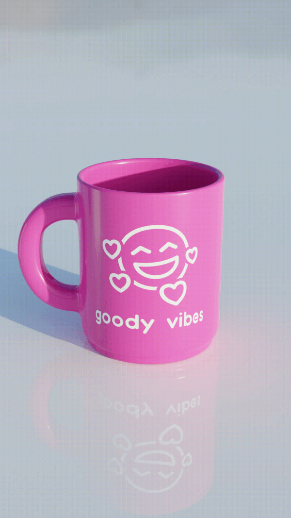 A pink coffee mug with the words " goody vibes ".