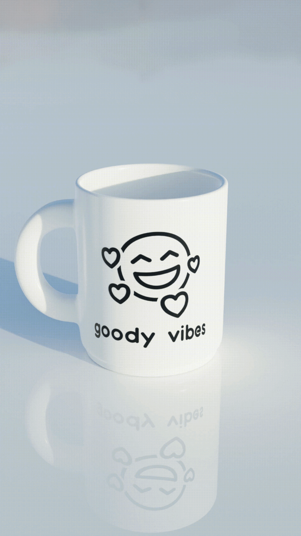 A white coffee mug with the words " goody vibes !" written on it.