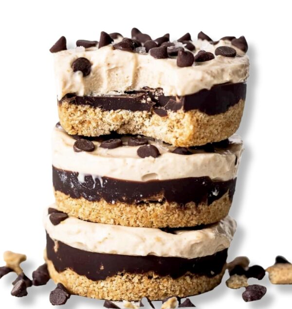 Three stacked cookies and cream ice cream sandwiches.