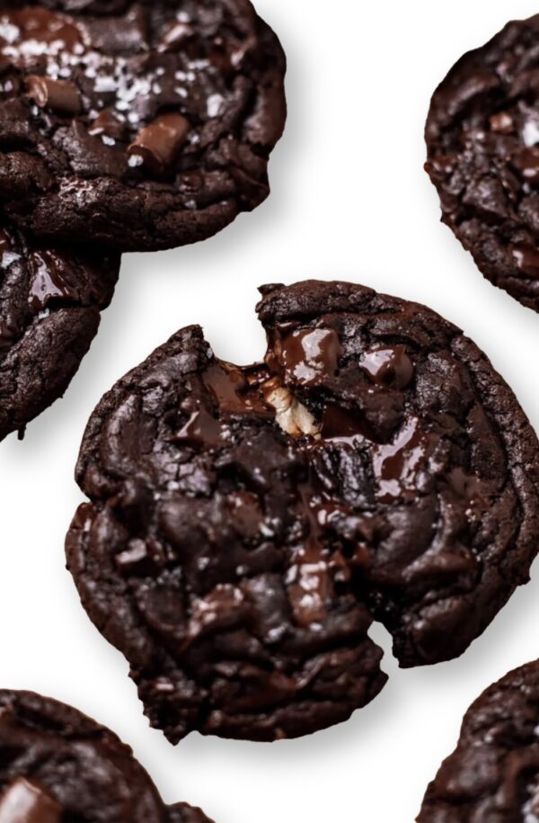 A close up of some chocolate cookies on top of a table.