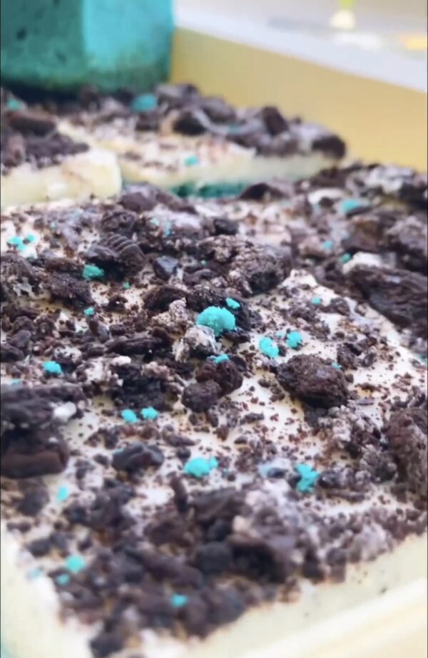 A close up of some chocolate and blue sprinkles