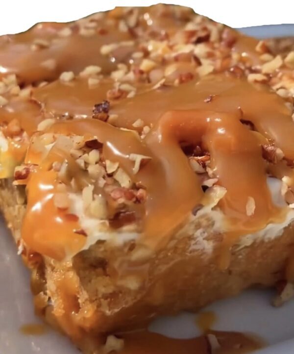 A close up of some cake with nuts and caramel