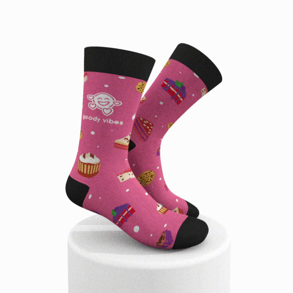 A pair of pink socks with cupcakes and other desserts.