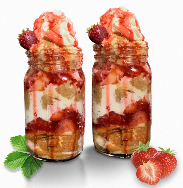 Two jars of food with strawberries and whipped cream.