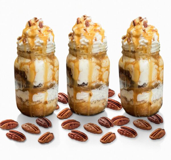 Three jars of ice cream with nuts on the side.