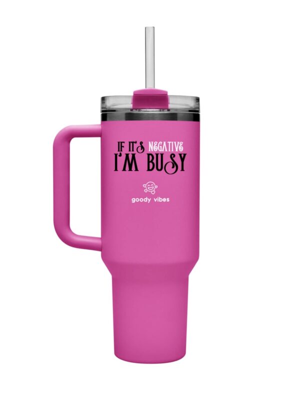 A pink cup with a straw in it