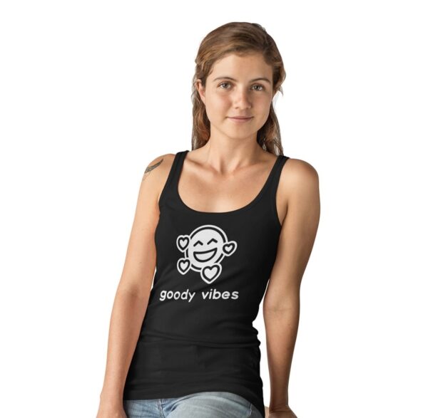 A woman wearing a black tank top with a monkey on it.