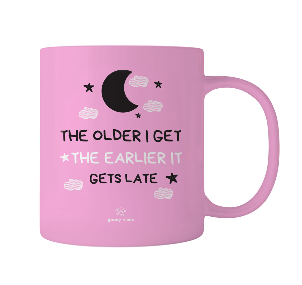 A pink coffee mug with the words " the older i get, the earlier it gets late ".